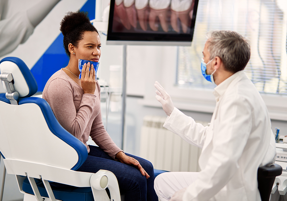 Woman Speaking With Dentist