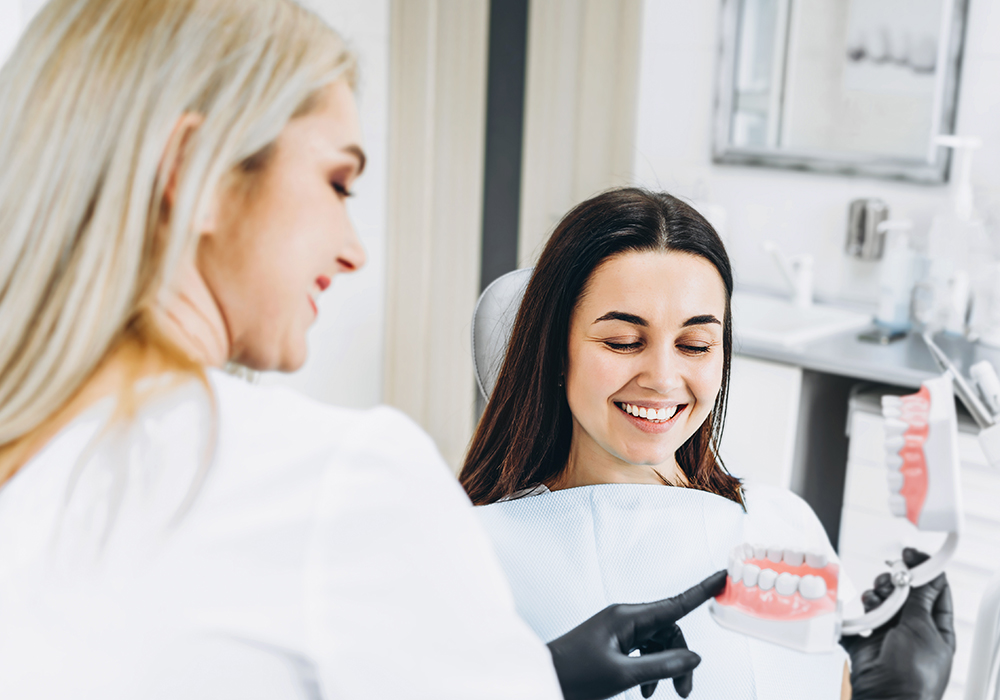 Dentist explaining denture to patient