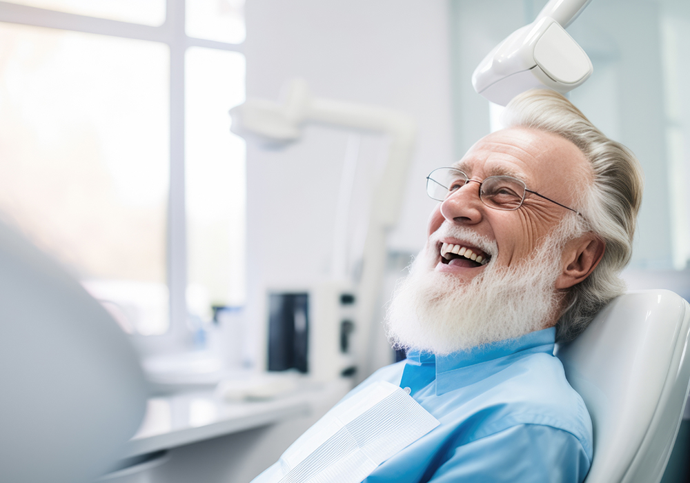 Man at denture fitting smiling