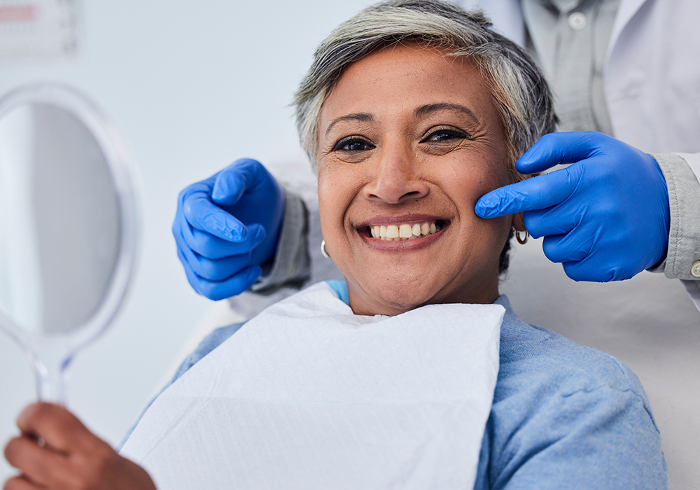 Close-up of a woman smiling with new dentures
