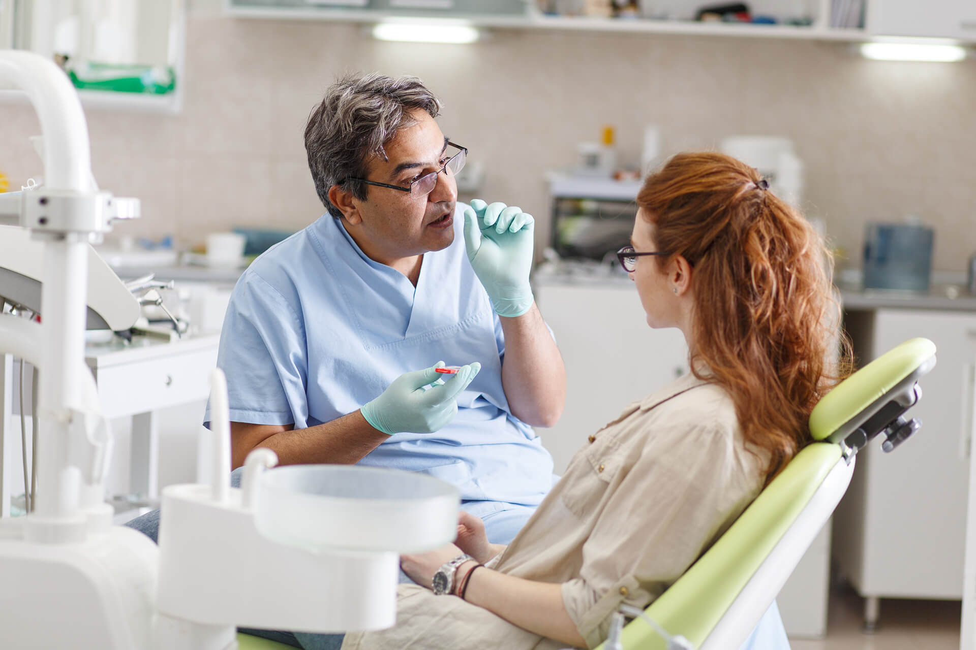 Dentist discussing oral health with a patient