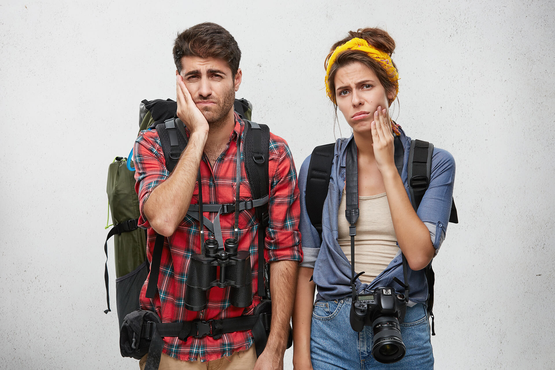 Hikers holding their jaws due to dental pain