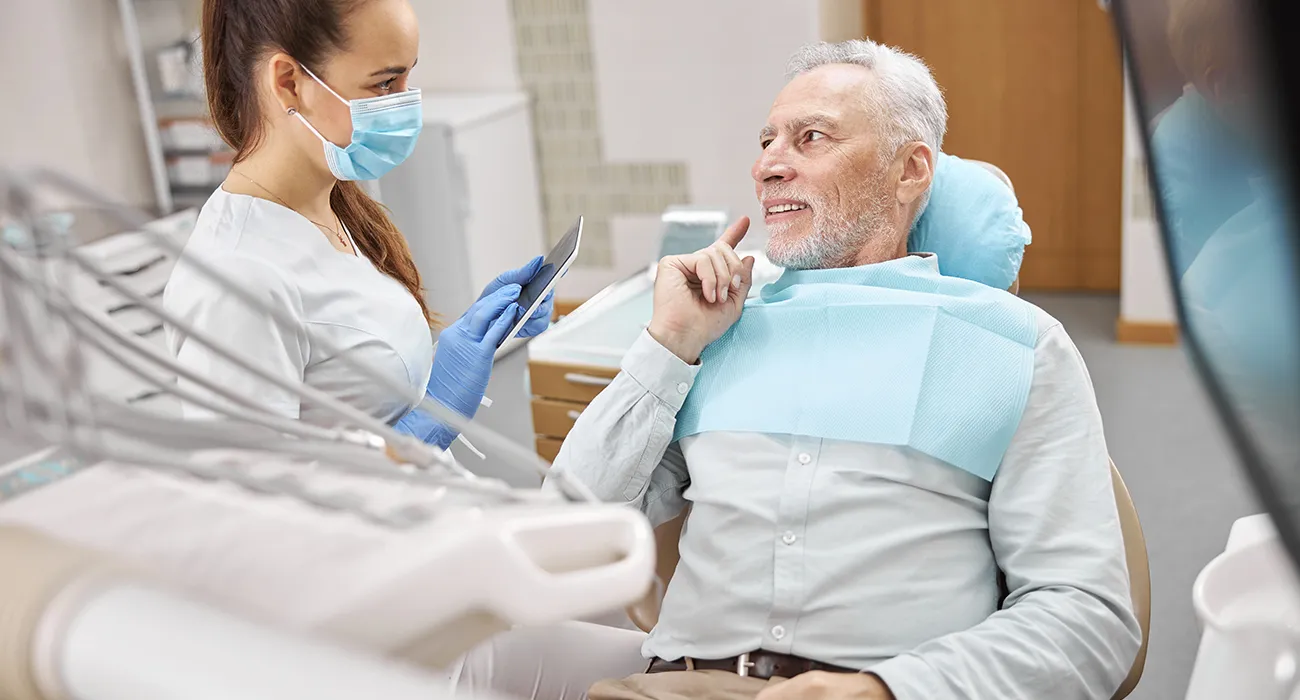 Dentist discussing dental care