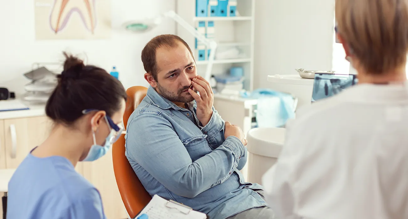 Patient with mouth pain at dentist
