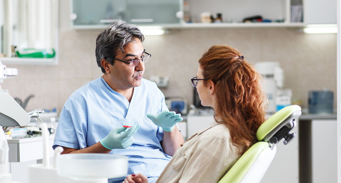 Urgent Dental Care Pennsylvania dentist talking with patient about their teeth